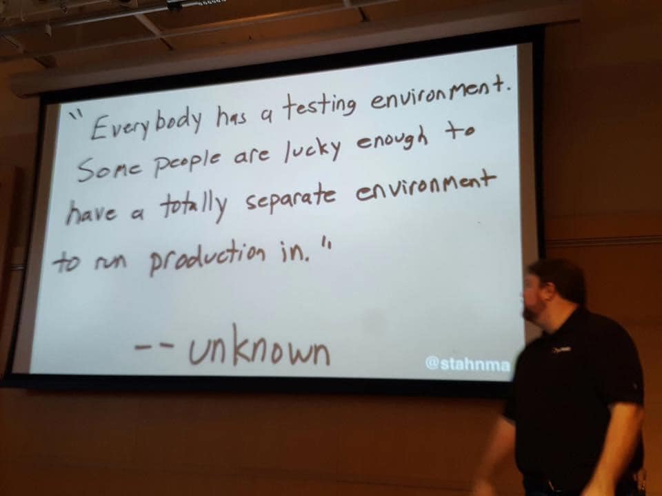 The meme is a humorous image of a whiteboard with a quote about coding and software development. The quote reads: "In a codebase as complex as a city, every citizen has a story to tell. Some are heroes, some are villains, some are just trying to survive." However, the actual quote on the whiteboard is: "Everyone has a plan until they get punched in the mouth."